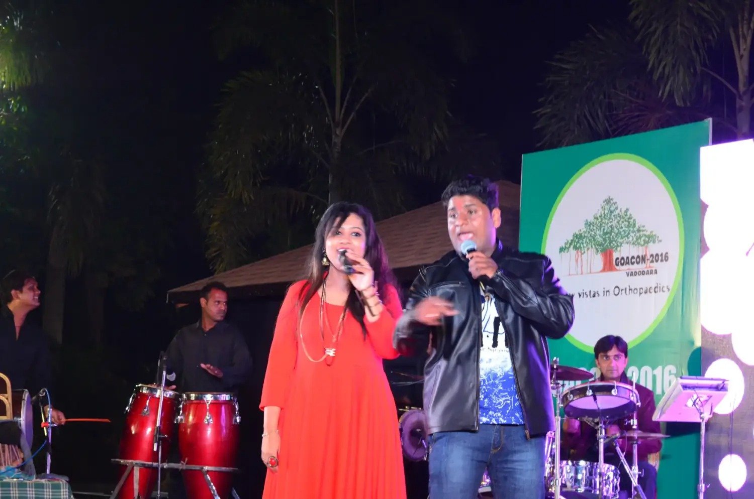 Man in suit speaking at podium with ITT logo on podium